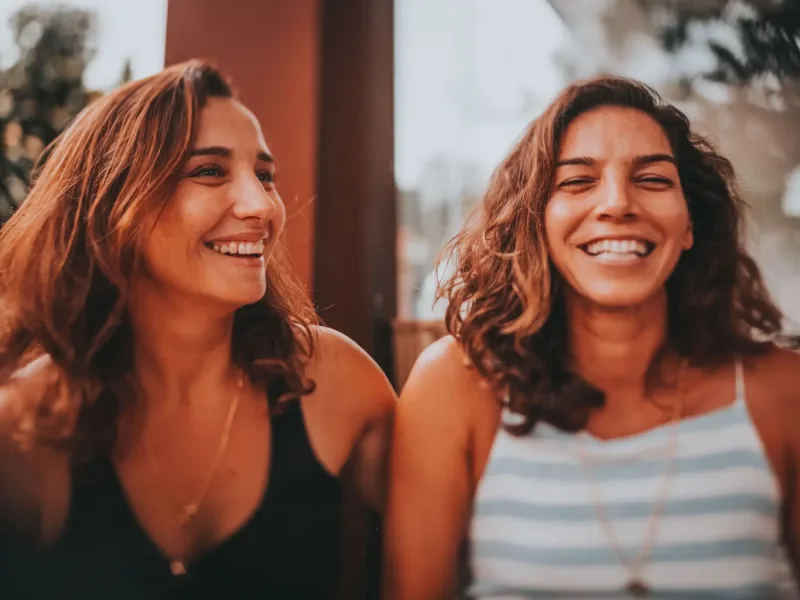 Two women smiling