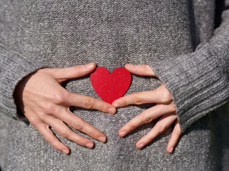 Woman with a heart over her stomach