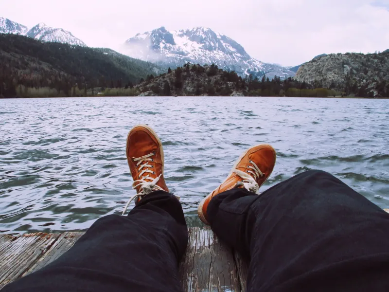 Person sat by a lake